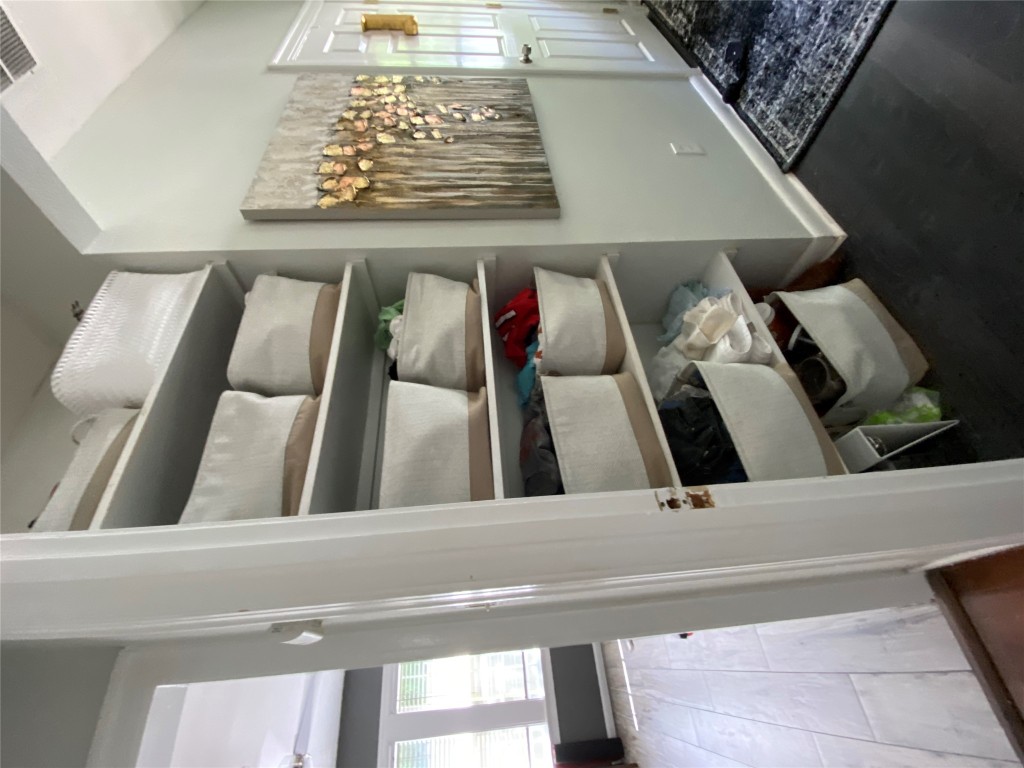 3804 Duval Street Austin, TX 78751 - Photo 9 of 21 a room with wooden floor and shoes