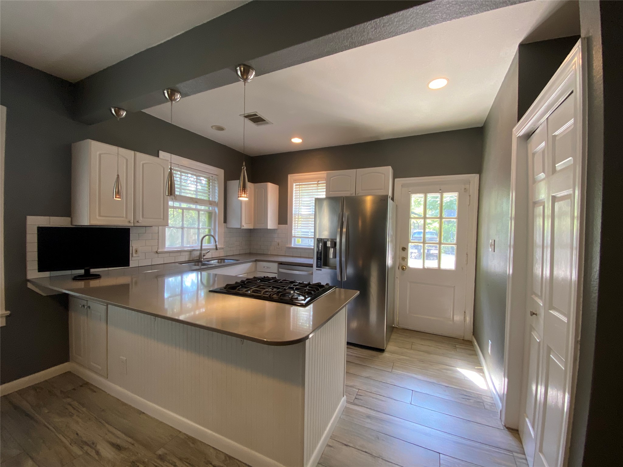 3804 Duval Street Austin, TX 78751 - Photo 10 of 21 a kitchen with stainless steel appliances granite countertop a sink stove and refrigerator