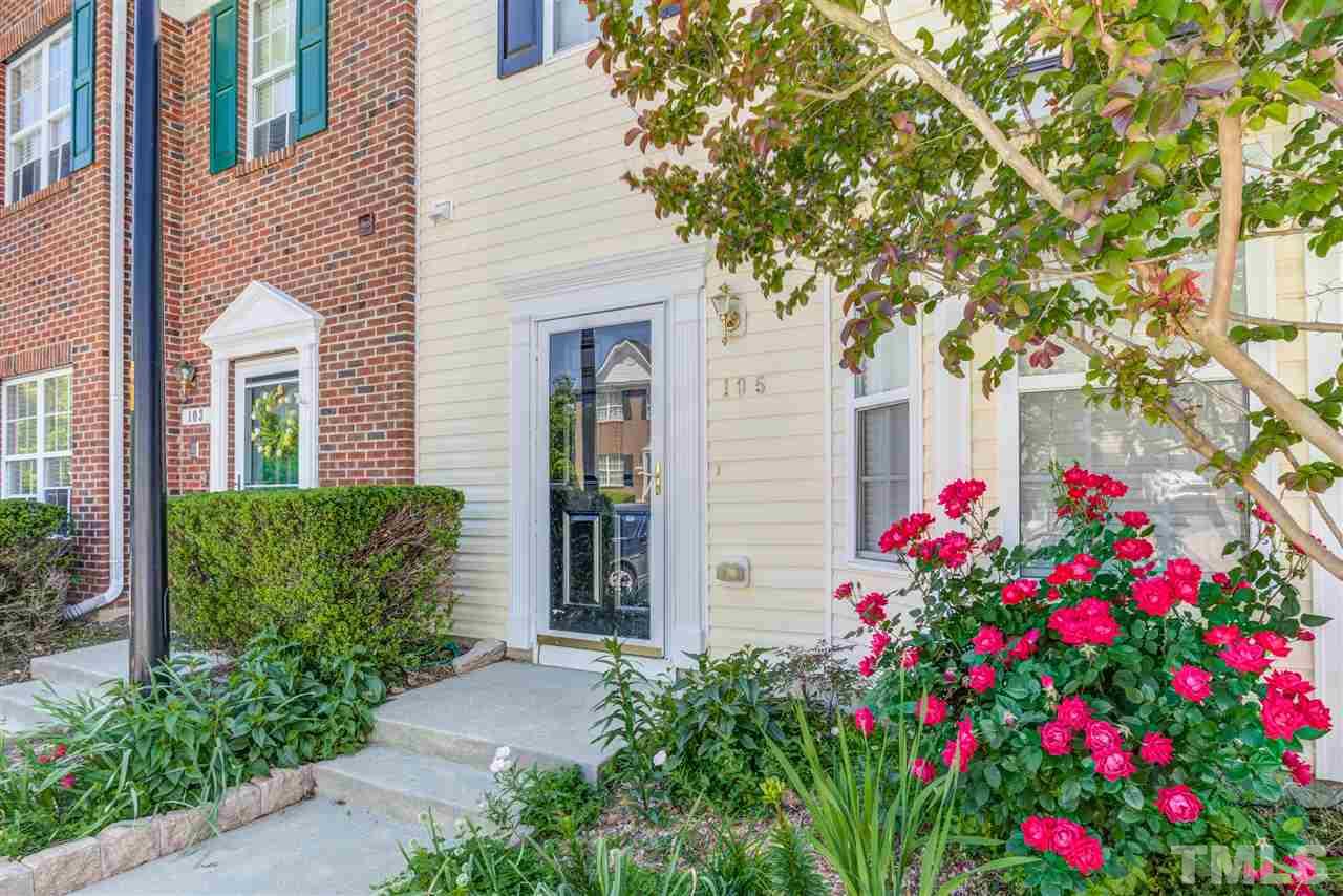 105 Watertree Lane Apex, NC 27502 - Photo 2 of 30 a flower plants in front of a house