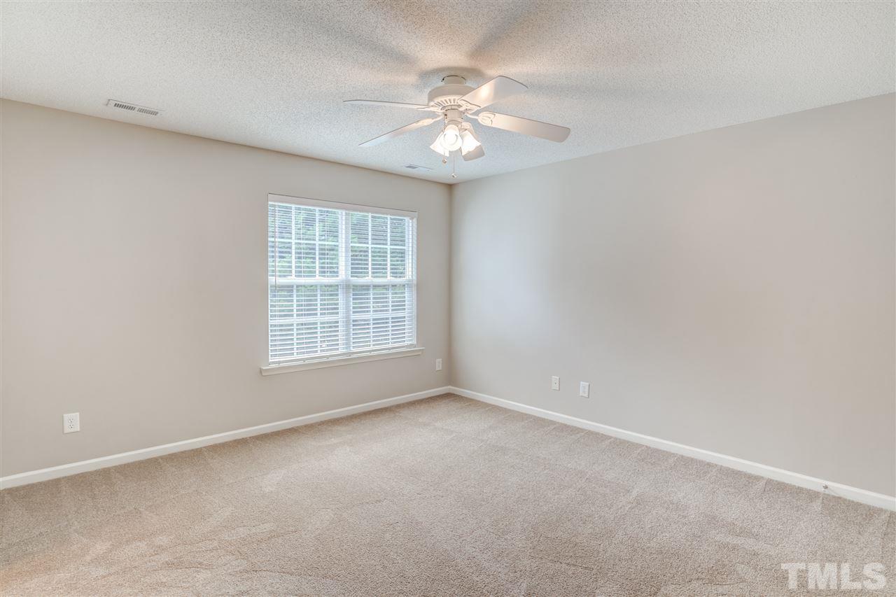 105 Watertree Lane Apex, NC 27502 - Photo 17 of 30 a view of an empty room with a window