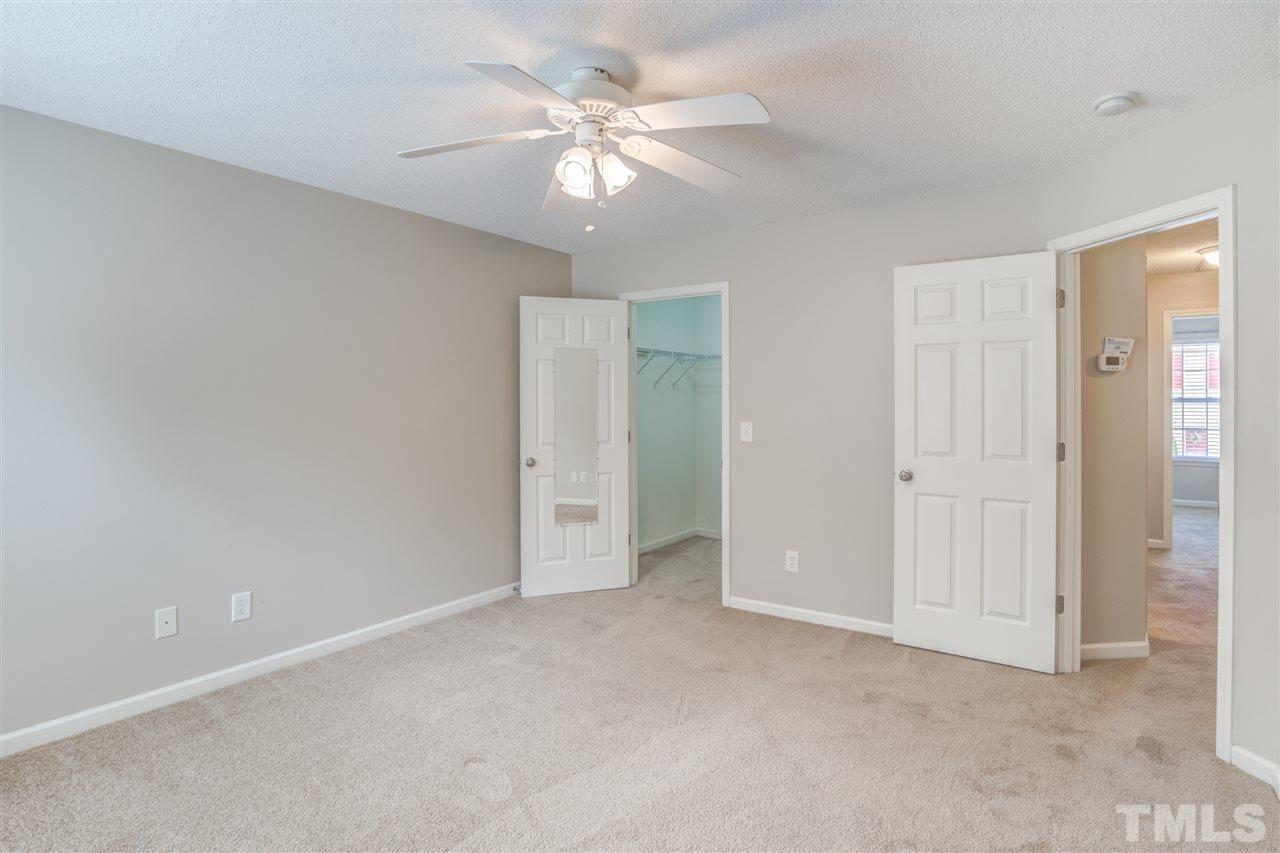 105 Watertree Lane Apex, NC 27502 - Photo 18 of 30 an empty room with fan and a ceiling fan