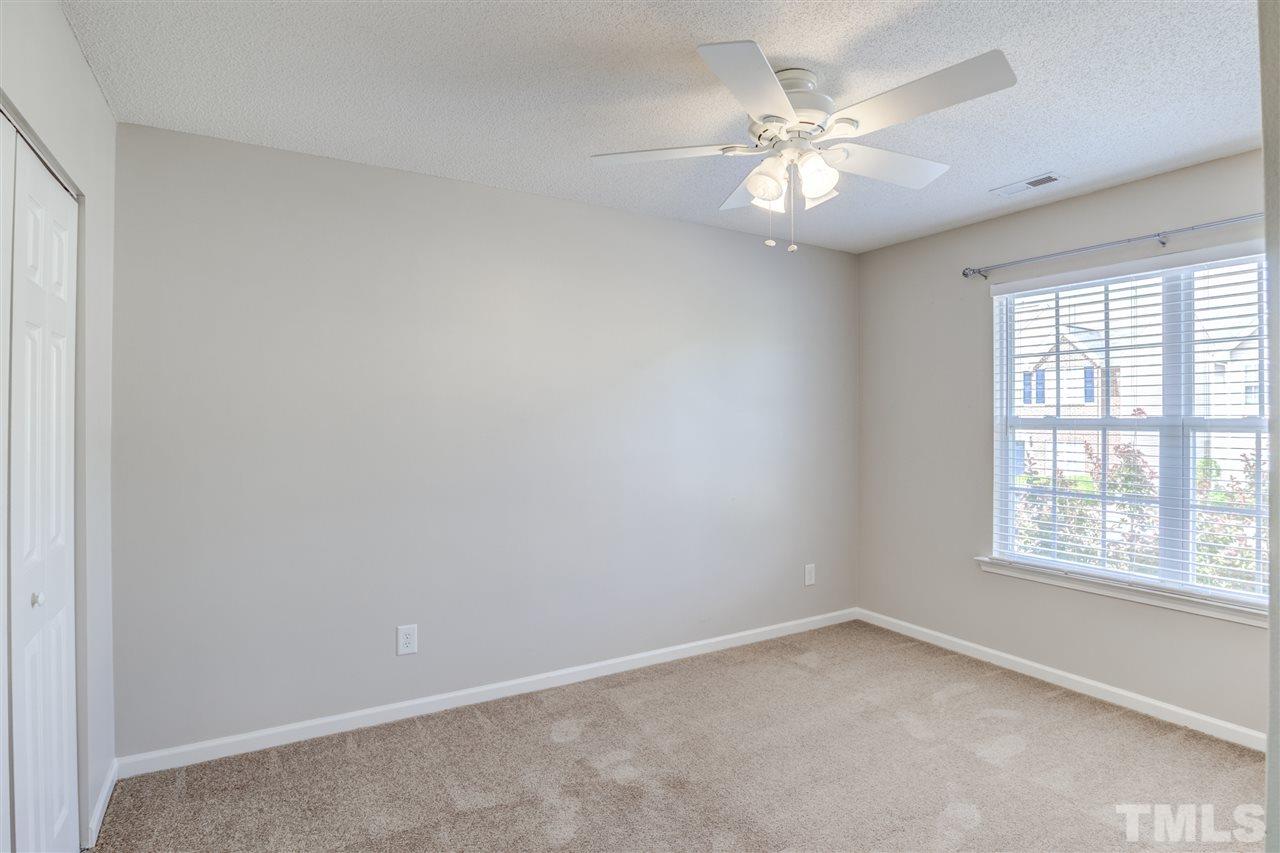 105 Watertree Lane Apex, NC 27502 - Photo 23 of 30 wooden floor in an empty room with a window