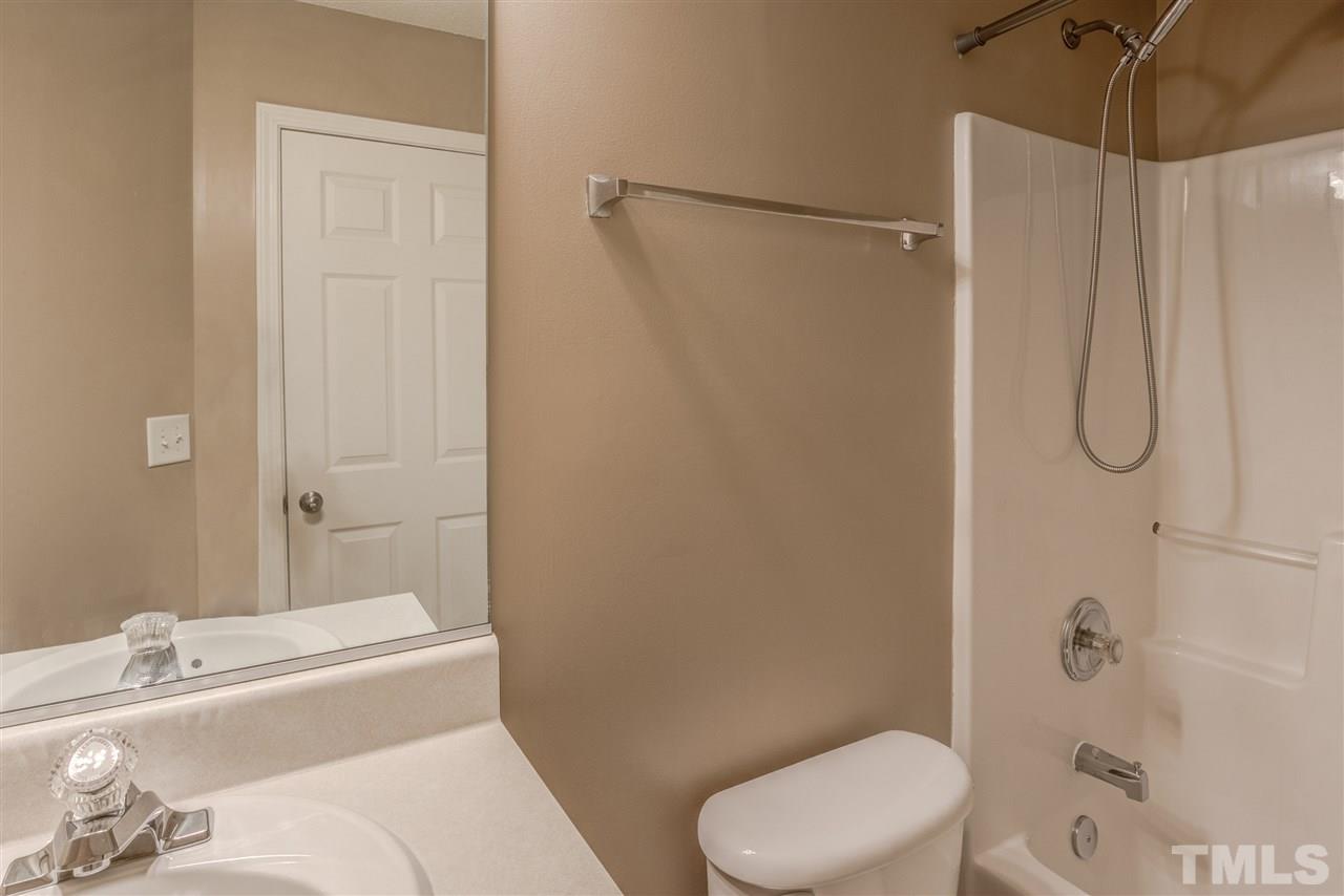 105 Watertree Lane Apex, NC 27502 - Photo 26 of 30 a bathroom with a sink toilet and shower