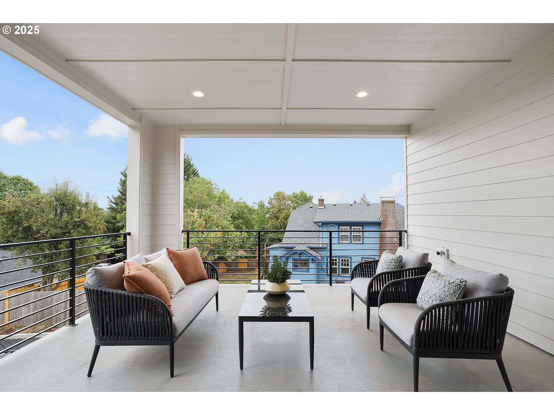 6024 Southwest 18th Drive Portland, OR 97239 - Photo 19 of 46 a balcony with furniture and a potted plant