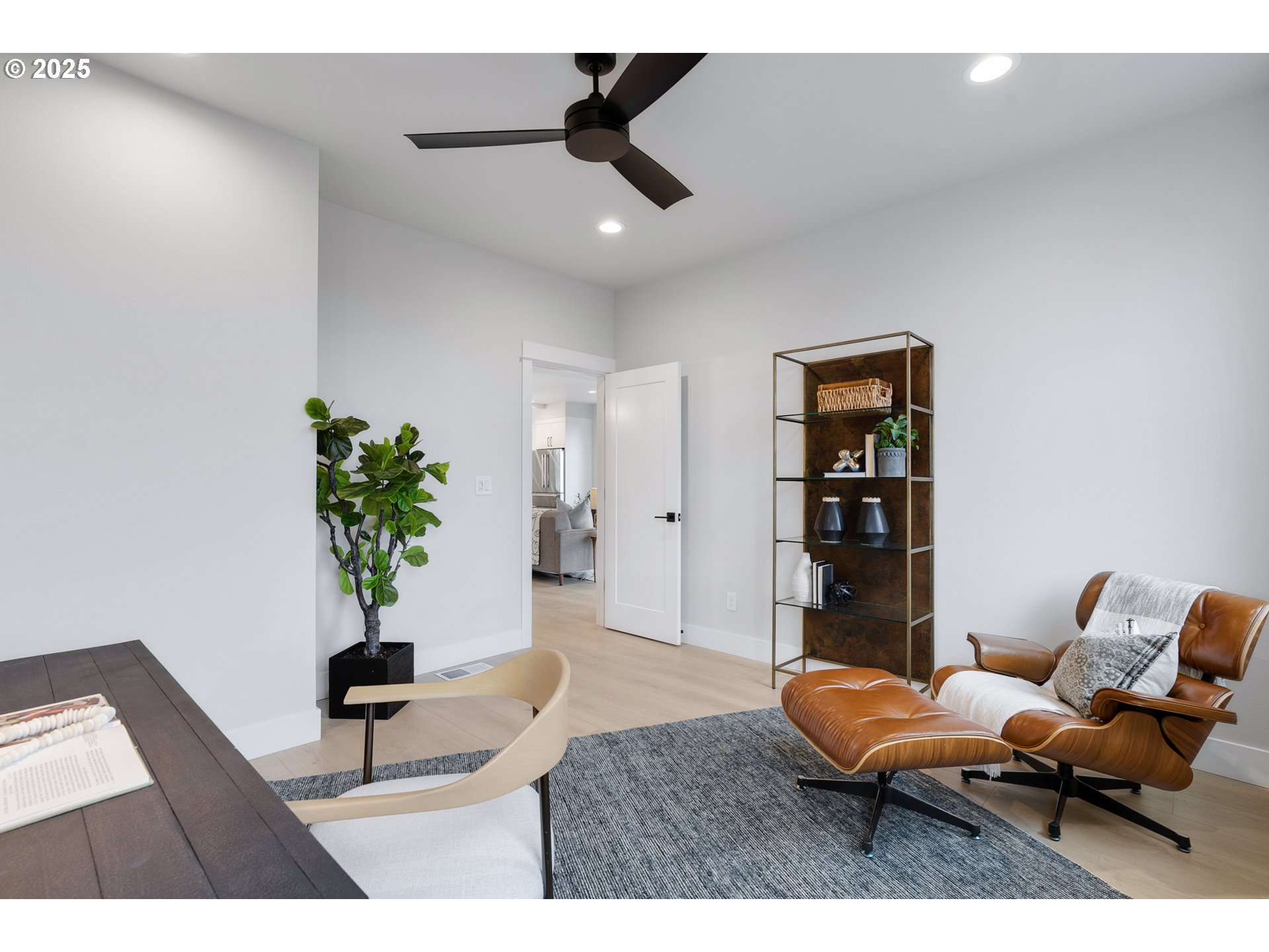 6024 Southwest 18th Drive Portland, OR 97239 - Photo 23 of 46 a living room with furniture and a potted plant