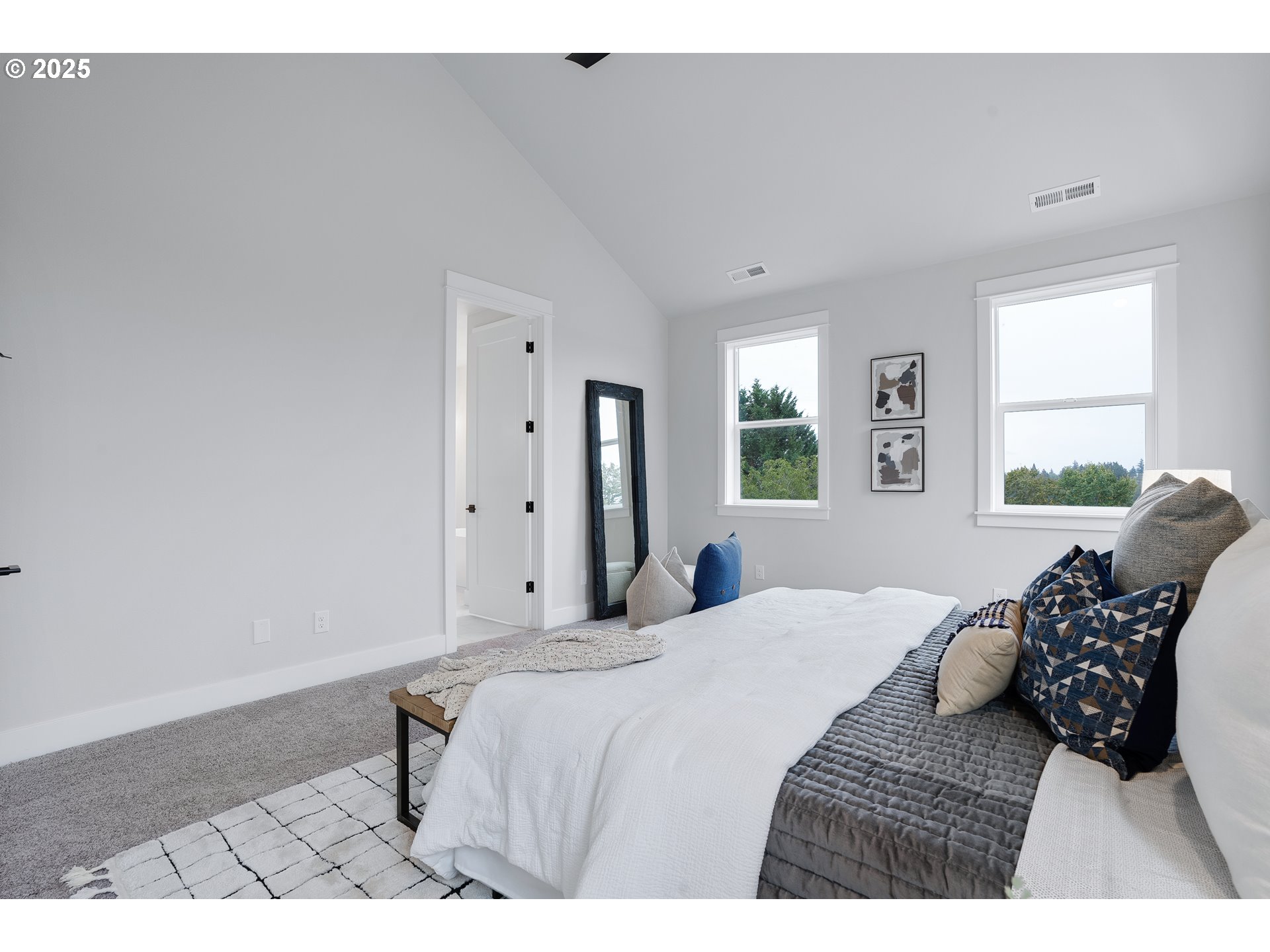 6024 Southwest 18th Drive Portland, OR 97239 - Photo 27 of 46 a bedroom with a bed window and couch