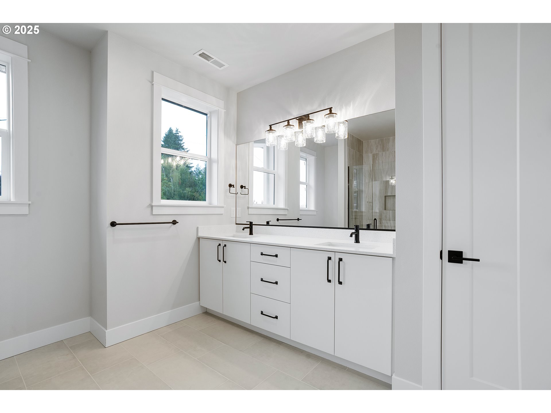 6024 Southwest 18th Drive Portland, OR 97239 - Photo 40 of 46 a bathroom with a double vanity sink and a mirror