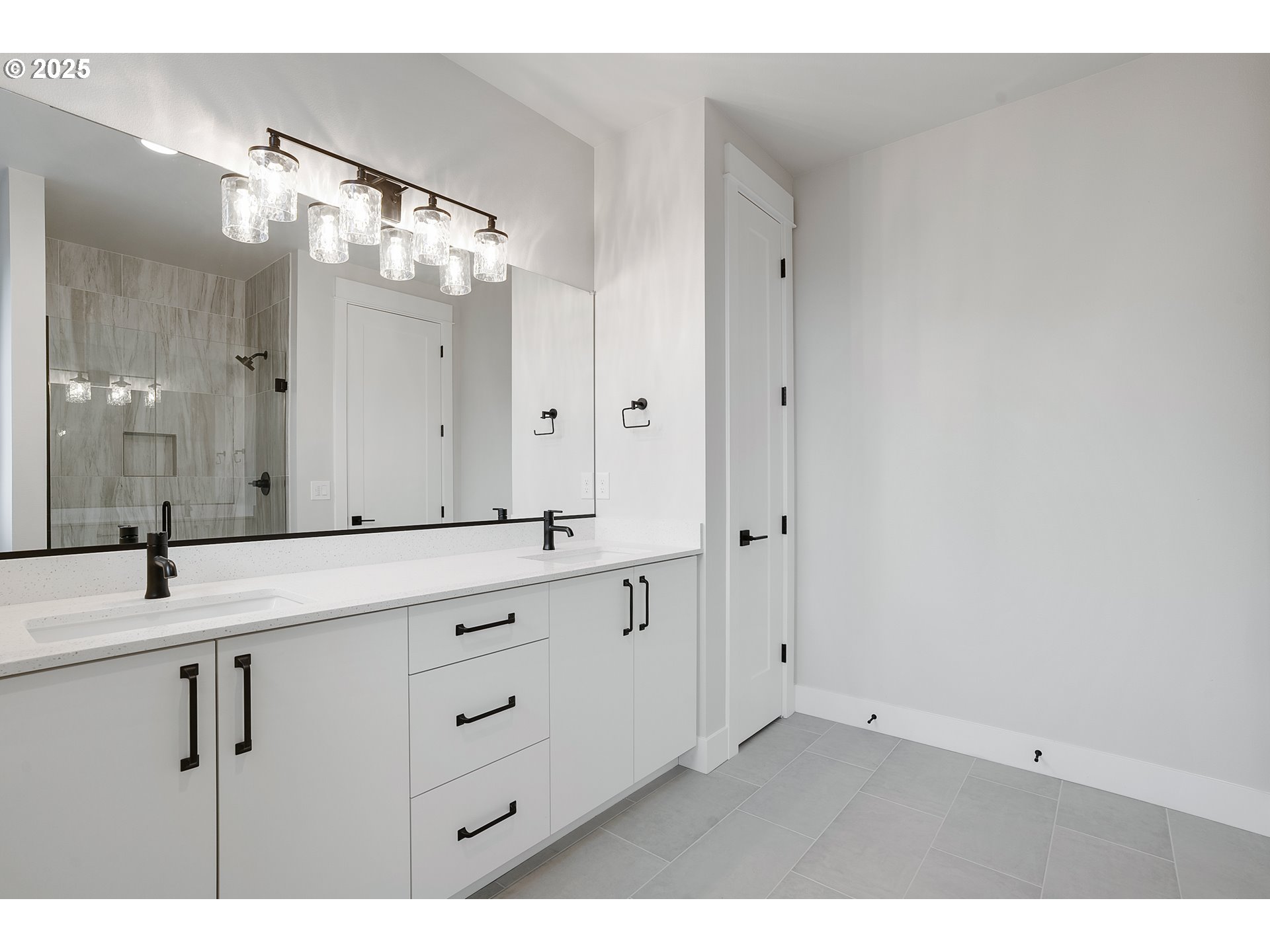 6024 Southwest 18th Drive Portland, OR 97239 - Photo 42 of 46 a bathroom with a double vanity sink mirror and double