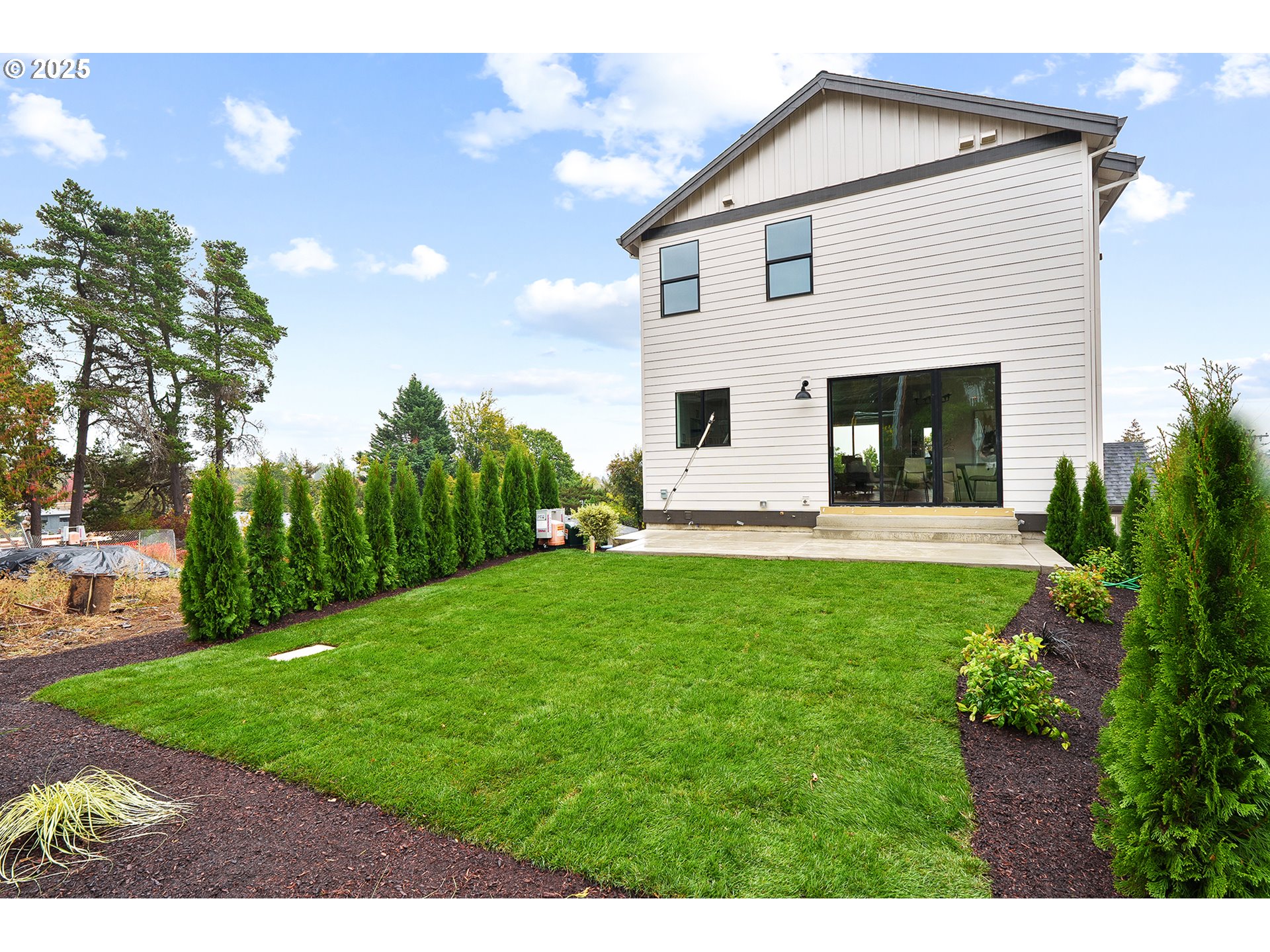 6024 Southwest 18th Drive Portland, OR 97239 - Photo 45 of 46 a view of a house with backyard and garden
