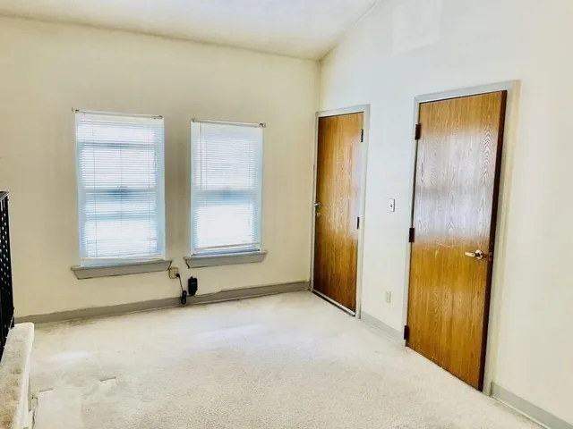 an empty room with windows