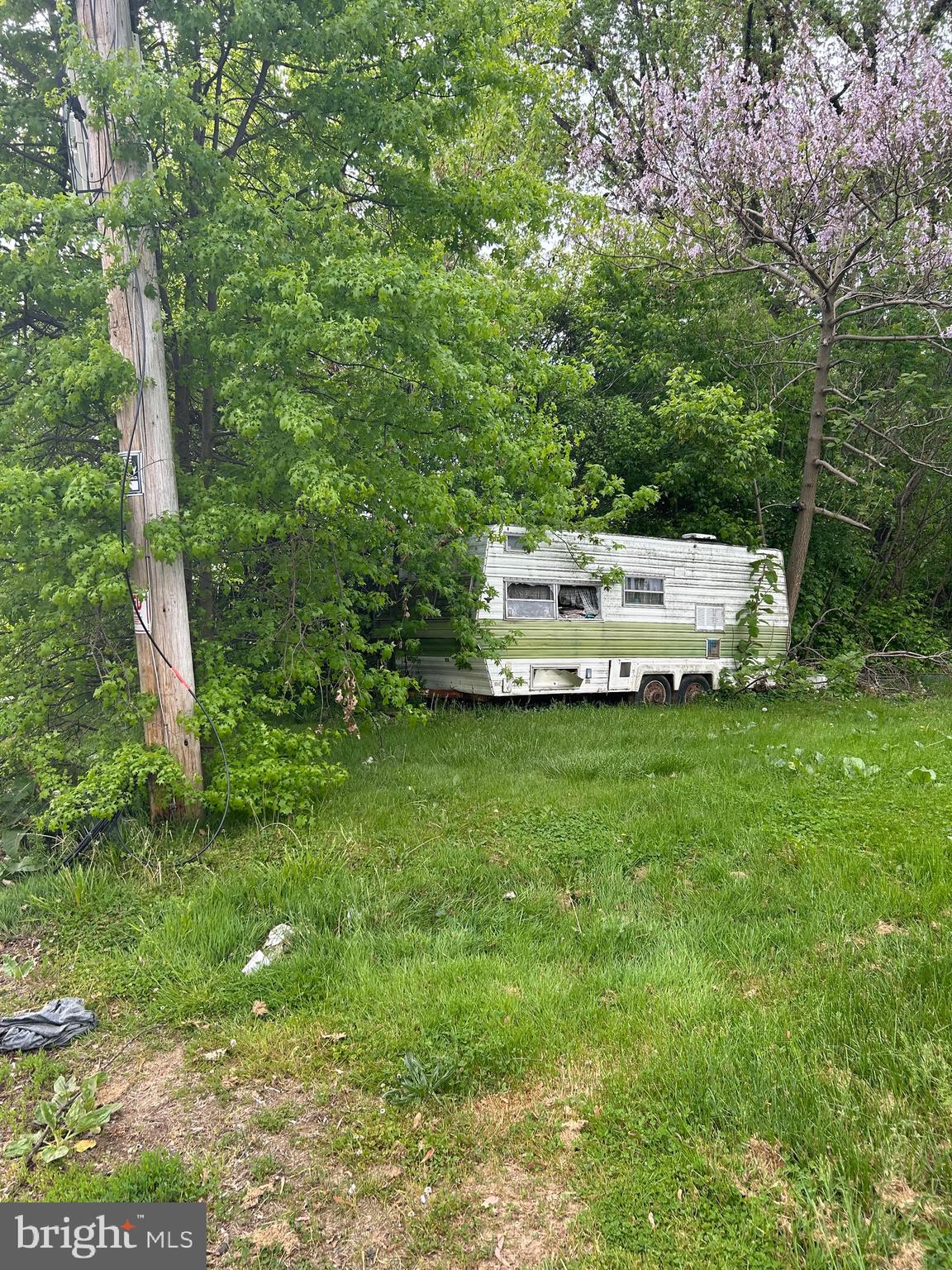 6 Old Ashton Road Philadelphia, PA 19152 - Photo 1 of 2 a view of a white house with a big yard and large trees