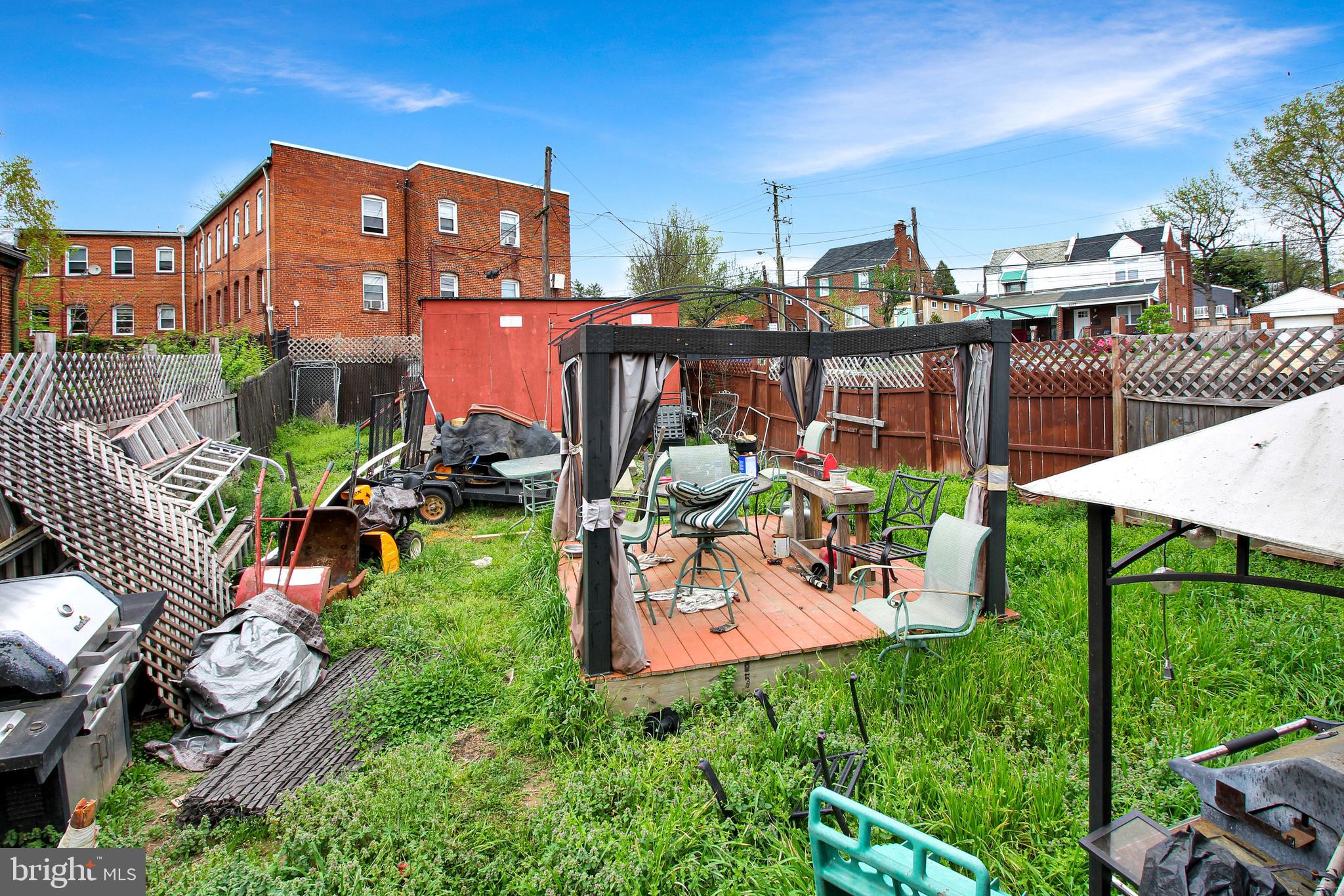 4380 Benning Road Northeast Washington, DC 20019 - Photo 14 of 14 a view of a chairs and table in a backyard