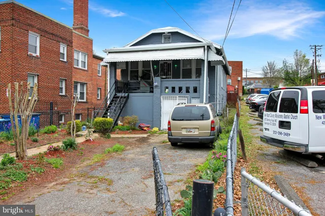 a view of multiple houses with yard