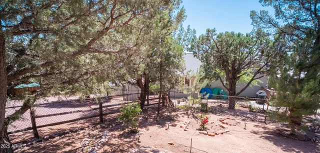 a backyard of a house with lots of green space