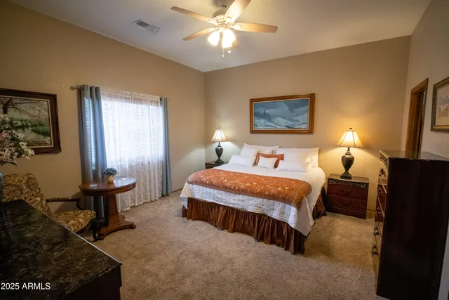 a spacious bedroom with a bed and window