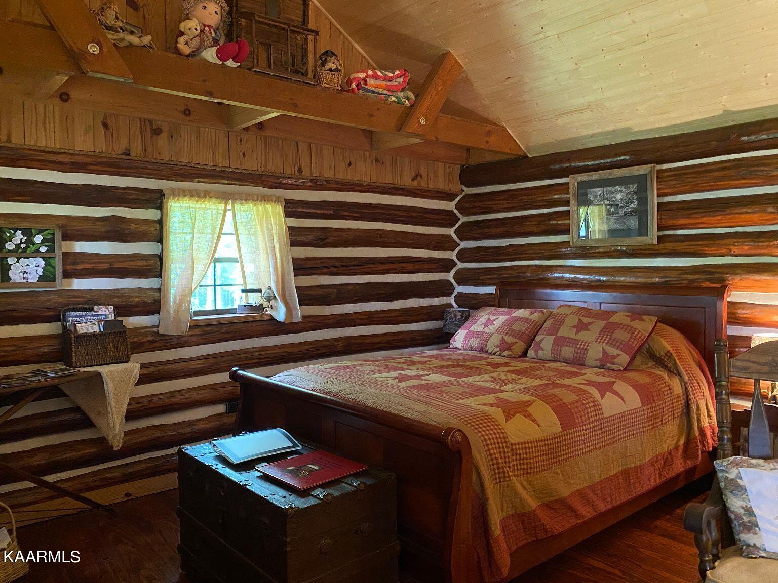 618 Coon Hollow Road Sunbright, TN 37872 - Photo 24 of 60 Log cabin sleeping area