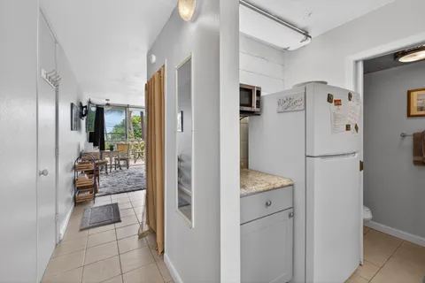 a kitchen with sink and cabinets