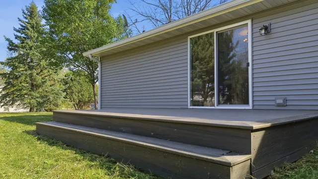 a front view of house with yard and trees