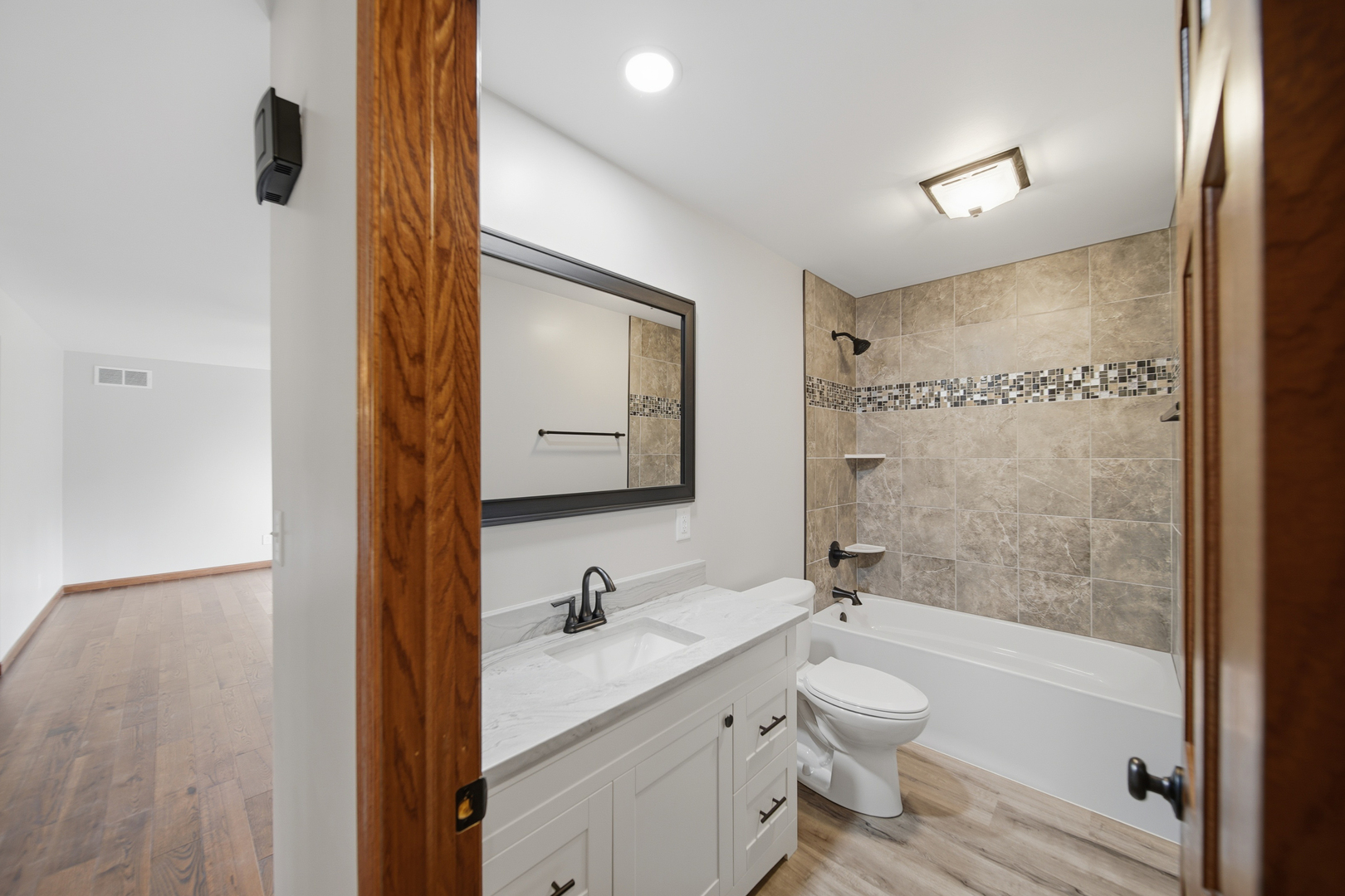 844 Hahn Avenue Dixon, IL 61021 - Photo 26 of 41 a bathroom with a granite countertop sink toilet a shower and a mirror