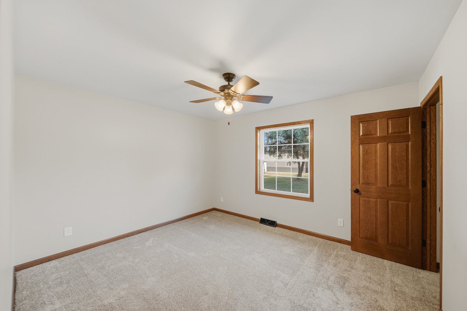 844 Hahn Avenue Dixon, IL 61021 - Photo 32 of 41 an empty room with window and ceiling fan