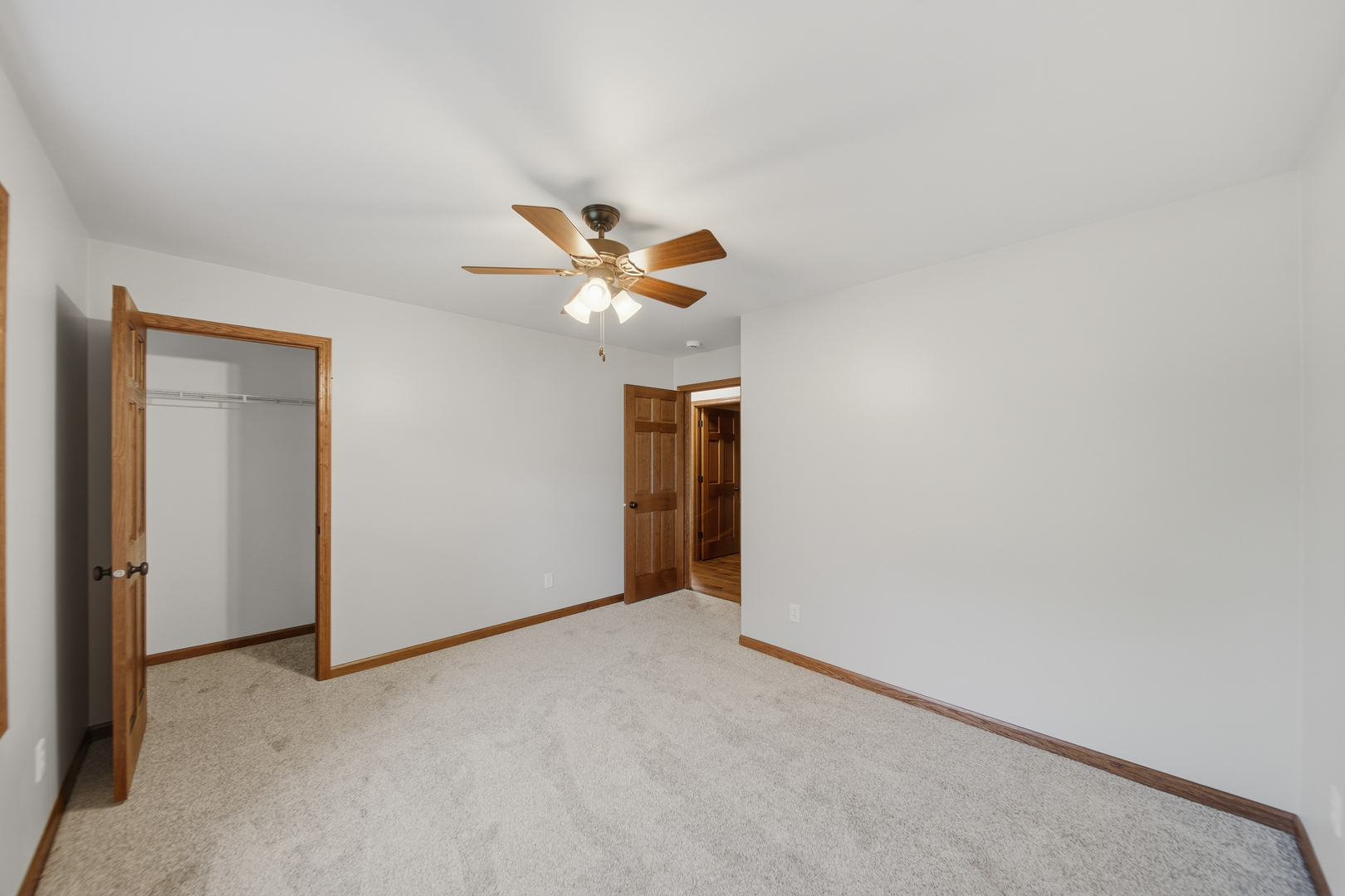 844 Hahn Avenue Dixon, IL 61021 - Photo 33 of 41 an empty room with a chandelier fan and a window