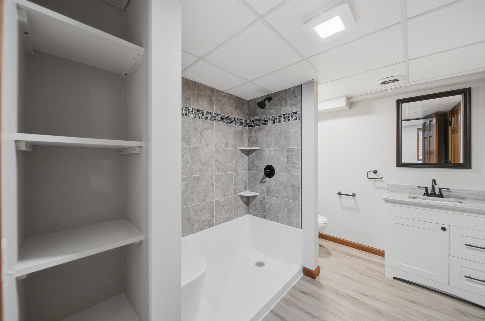 844 Hahn Avenue Dixon, IL 61021 - Photo 40 of 41 a bathroom with a bathtub shower sink vanity and toilet