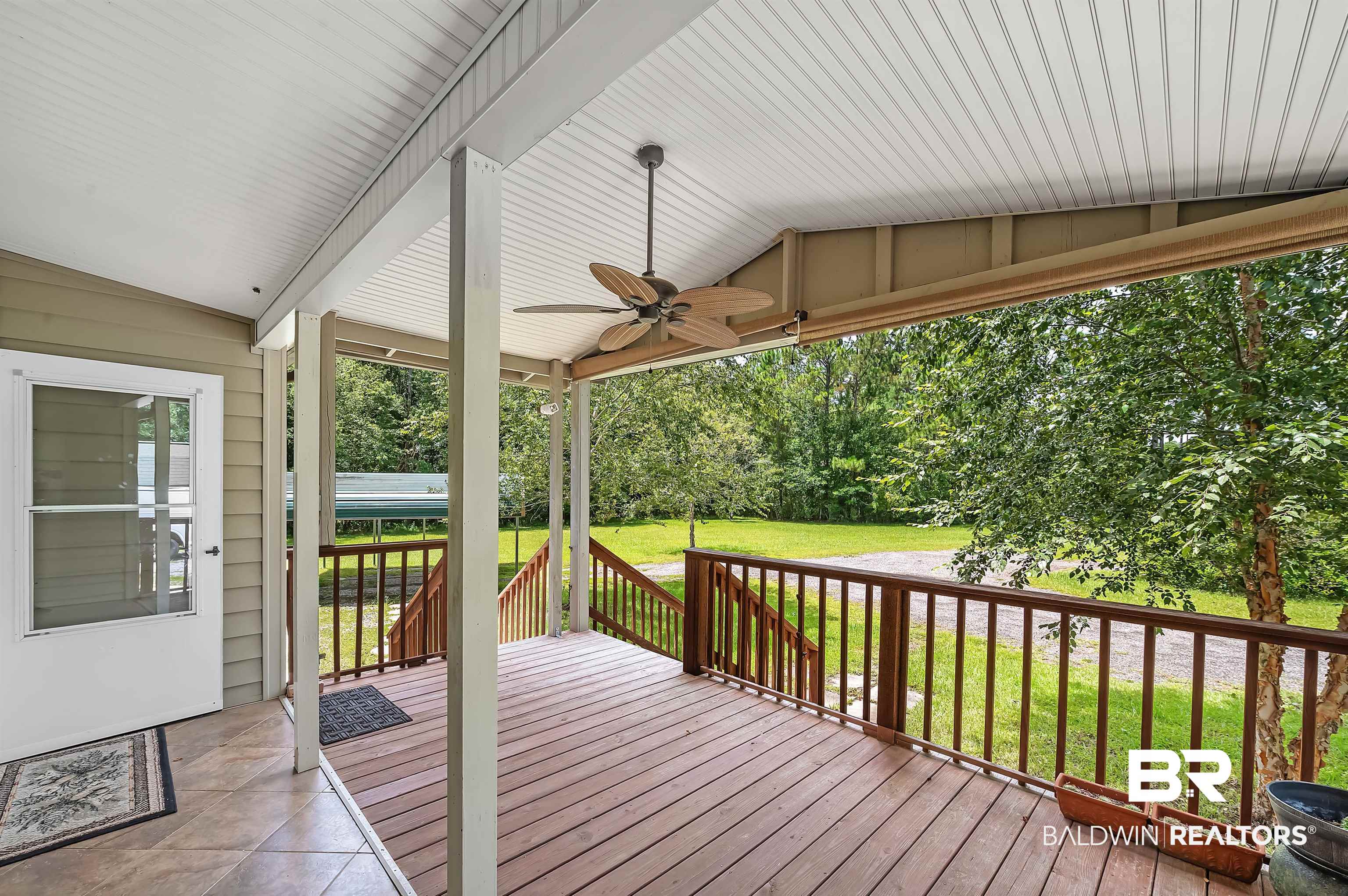 10970 Stucki Road Elberta, AL 36530 - Photo 5 of 56 Wooden deck featuring a lawn and ceiling fan