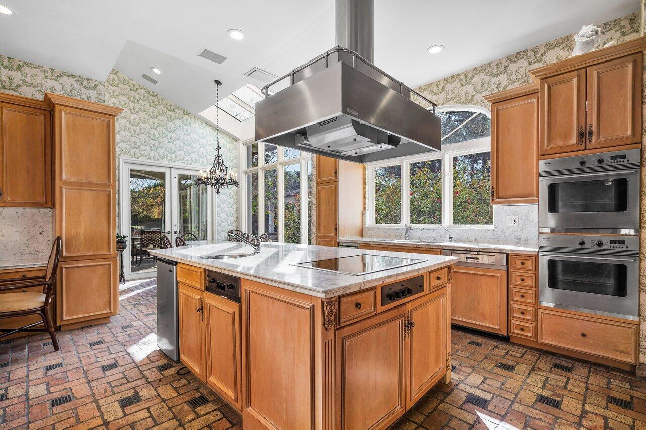 6024 Le Lac Road Boca Raton, FL 33496 - Photo 12 of 37 a kitchen with stainless steel appliances granite countertop a stove and a sink