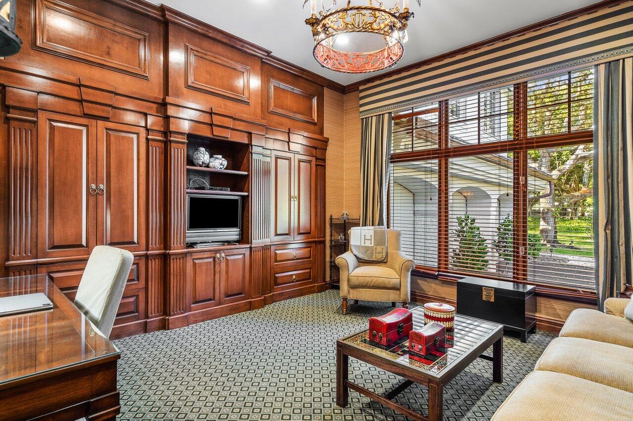 6024 Le Lac Road Boca Raton, FL 33496 - Photo 14 of 37 a living room with furniture a rug and a flat screen tv