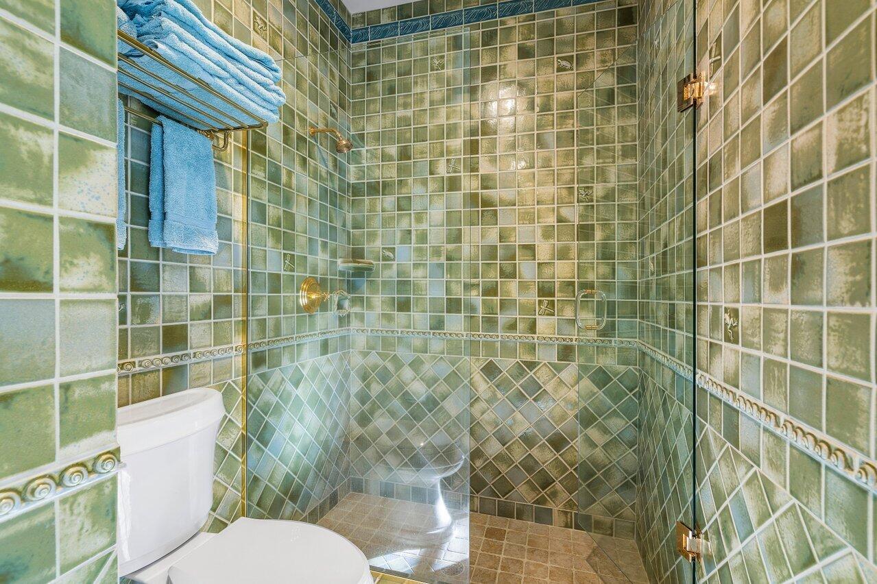 6024 Le Lac Road Boca Raton, FL 33496 - Photo 16 of 37 a bathroom with a toilet and shower