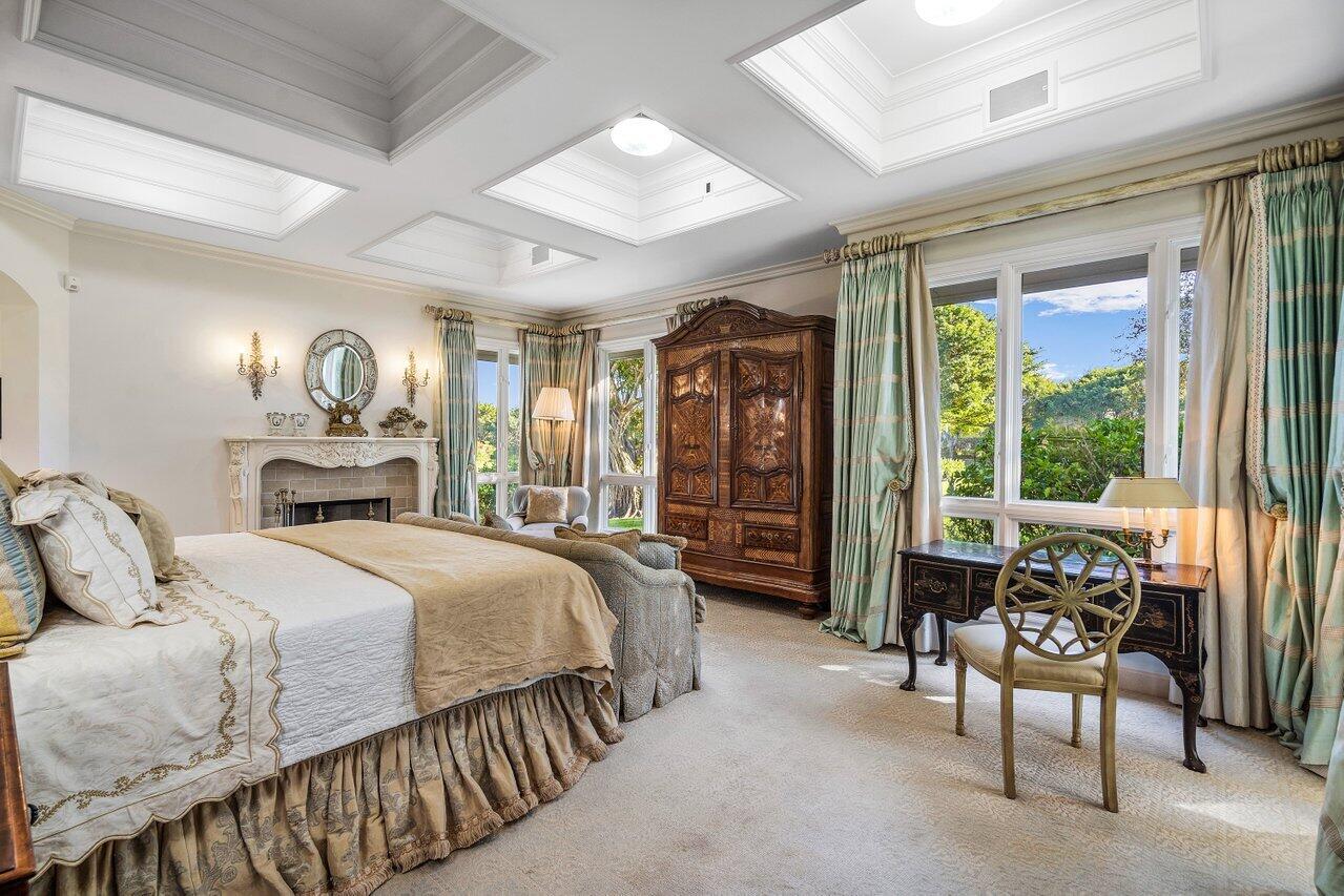 6024 Le Lac Road Boca Raton, FL 33496 - Photo 17 of 37 a bedroom with a bed and a large window