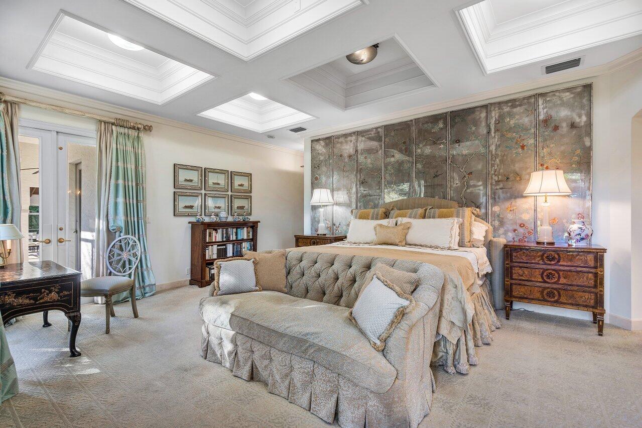 6024 Le Lac Road Boca Raton, FL 33496 - Photo 18 of 37 a bedroom with a bed and a table