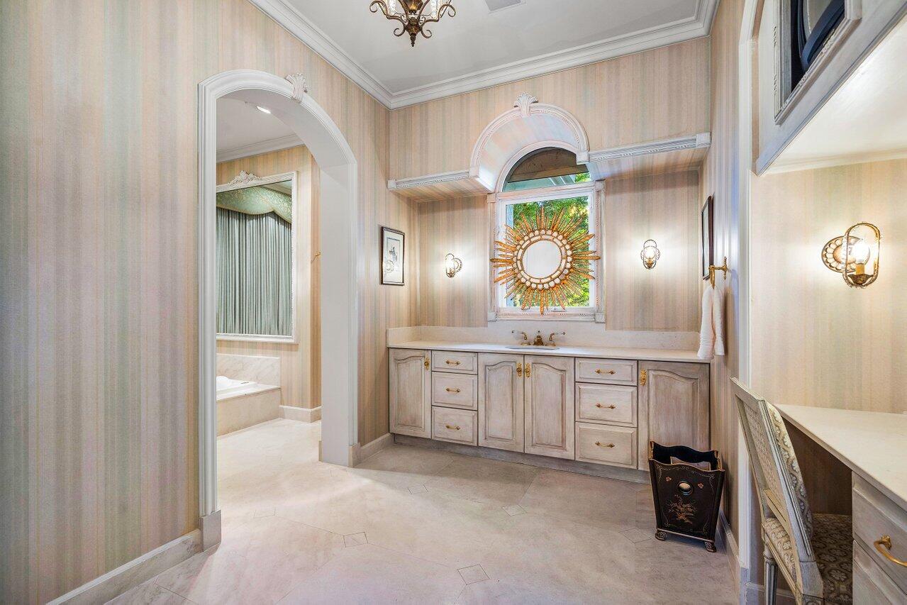 6024 Le Lac Road Boca Raton, FL 33496 - Photo 19 of 37 a spacious bathroom with a granite countertop sink a mirror and a bathtub