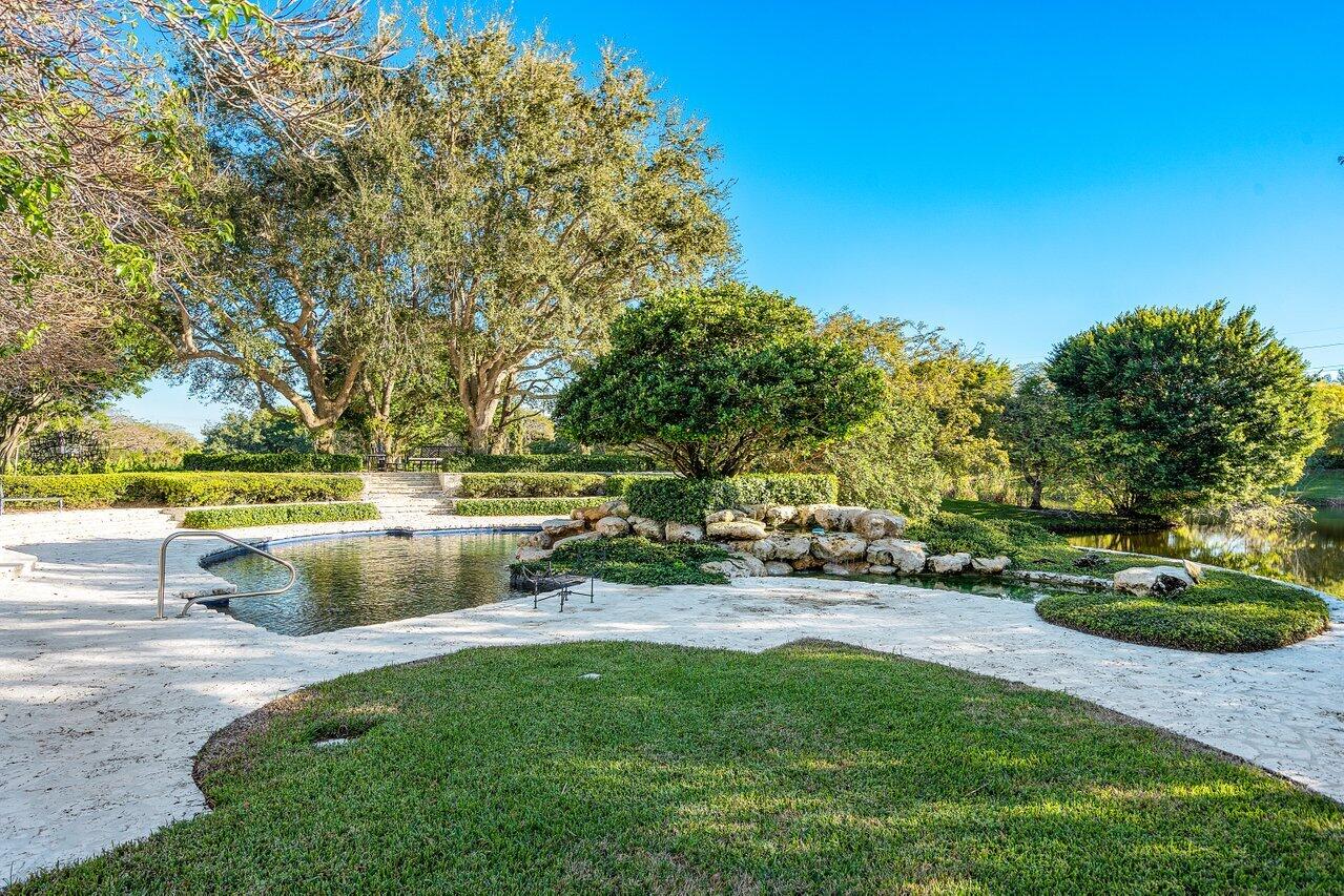 6024 Le Lac Road Boca Raton, FL 33496 - Photo 27 of 37 a view of a swimming pool with a patio