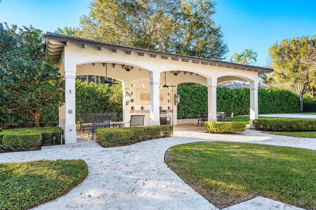 6024 Le Lac Road Boca Raton, FL 33496 - Photo 28 of 37 a view of a house with backyard and porch
