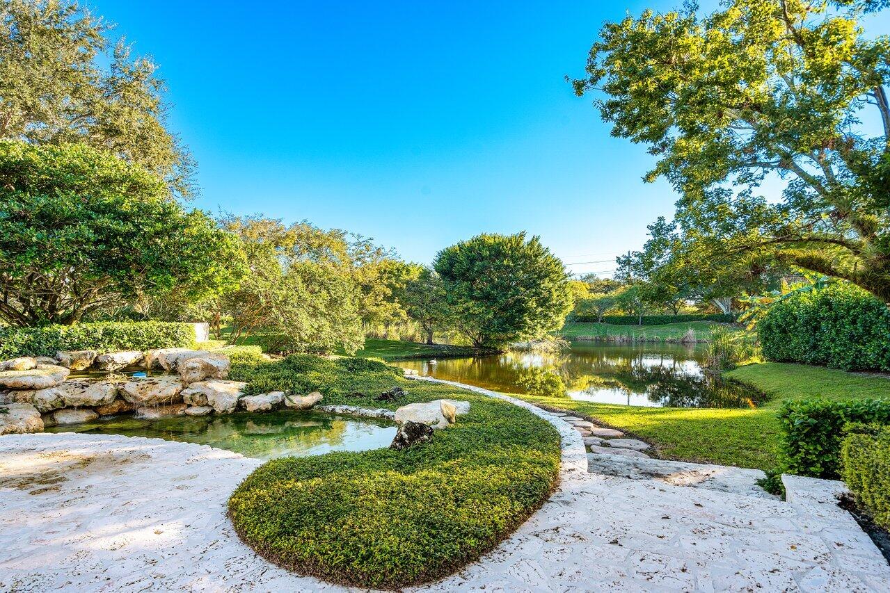 6024 Le Lac Road Boca Raton, FL 33496 - Photo 29 of 37 a view of a lake with a house