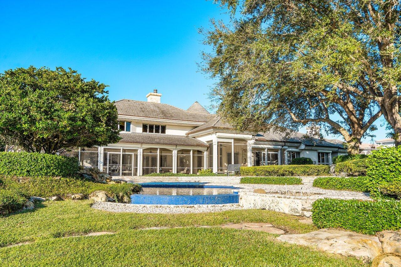 6024 Le Lac Road Boca Raton, FL 33496 - Photo 30 of 37 a front view of a house with a yard
