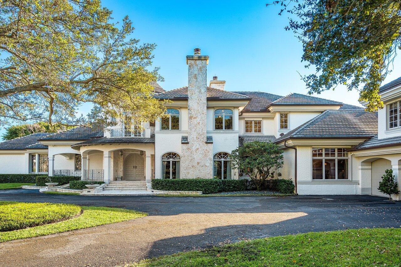 6024 Le Lac Road Boca Raton, FL 33496 - Photo 3 of 37 a front view of a house with swimming pool having outdoor seating
