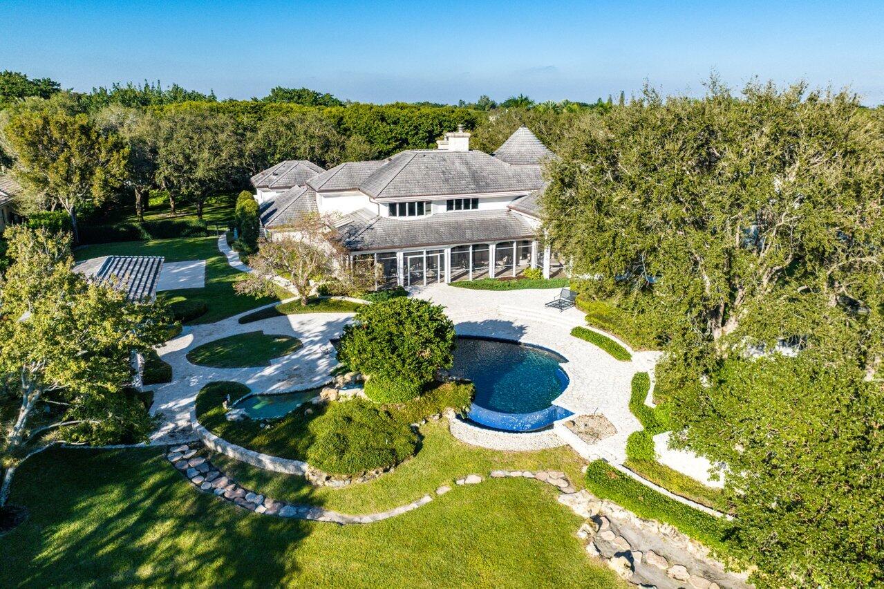 6024 Le Lac Road Boca Raton, FL 33496 - Photo 35 of 37 a view of a house with a yard and garden