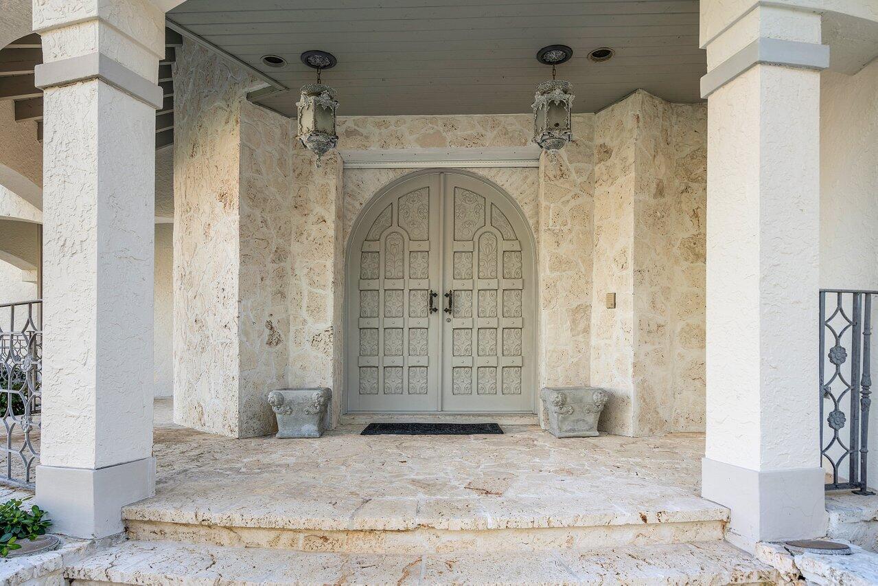 6024 Le Lac Road Boca Raton, FL 33496 - Photo 4 of 37 a view of a hallway with wooden door
