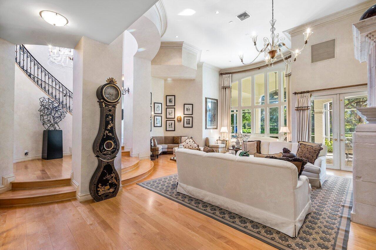 6024 Le Lac Road Boca Raton, FL 33496 - Photo 7 of 37 a living room with furniture windows and a chandelier