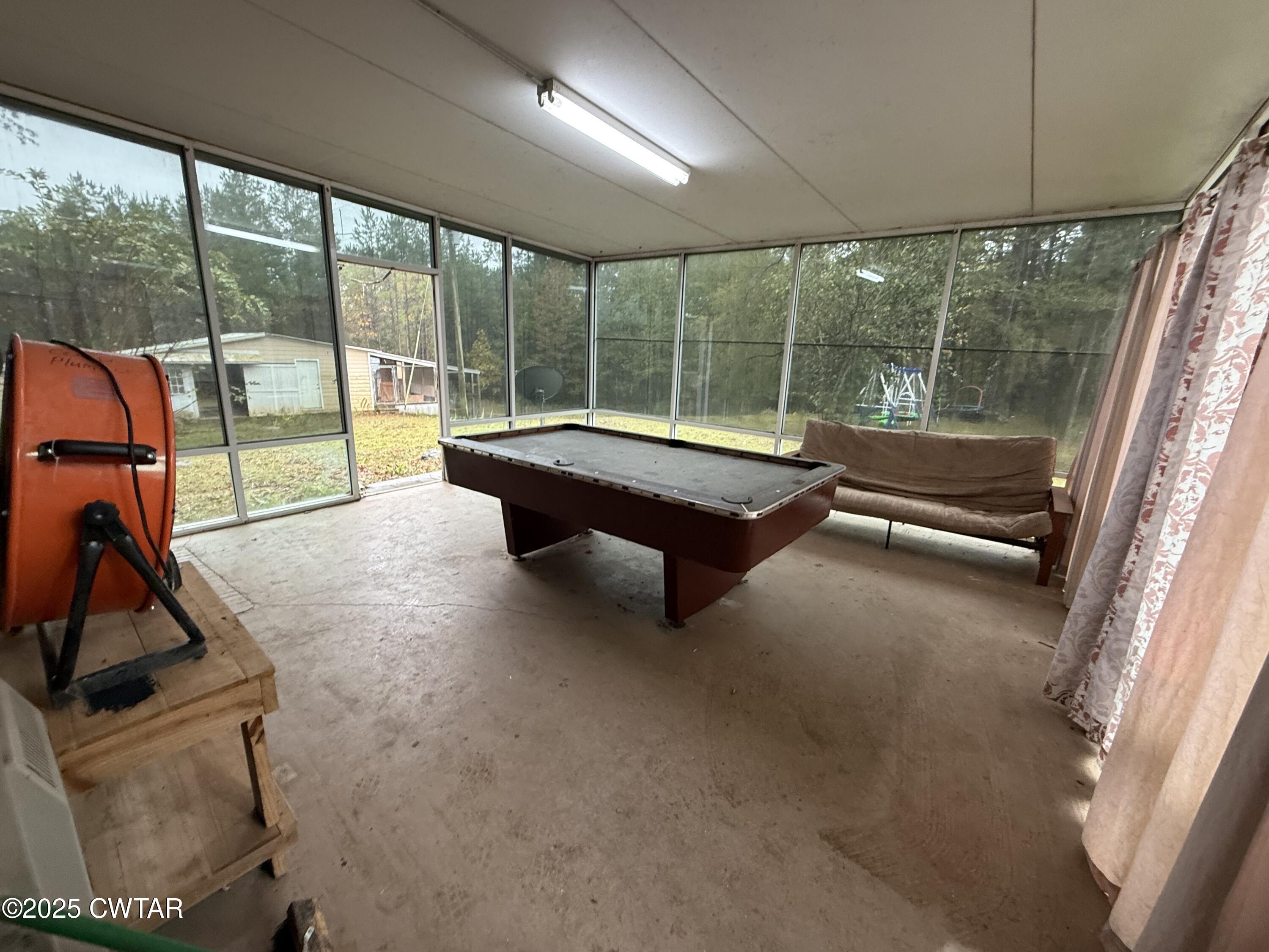 5264 Hines Gin Road Selmer, TN 38375 - Photo 11 of 19 a building outdoor space with seating