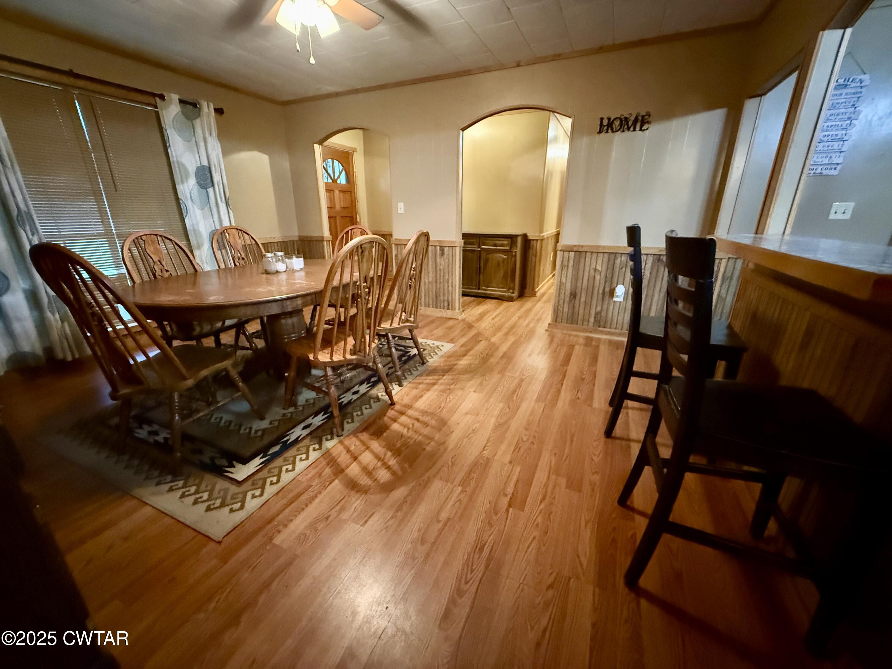 5264 Hines Gin Road Selmer, TN 38375 - Photo 3 of 19 a view of a dining room with furniture and wooden floor