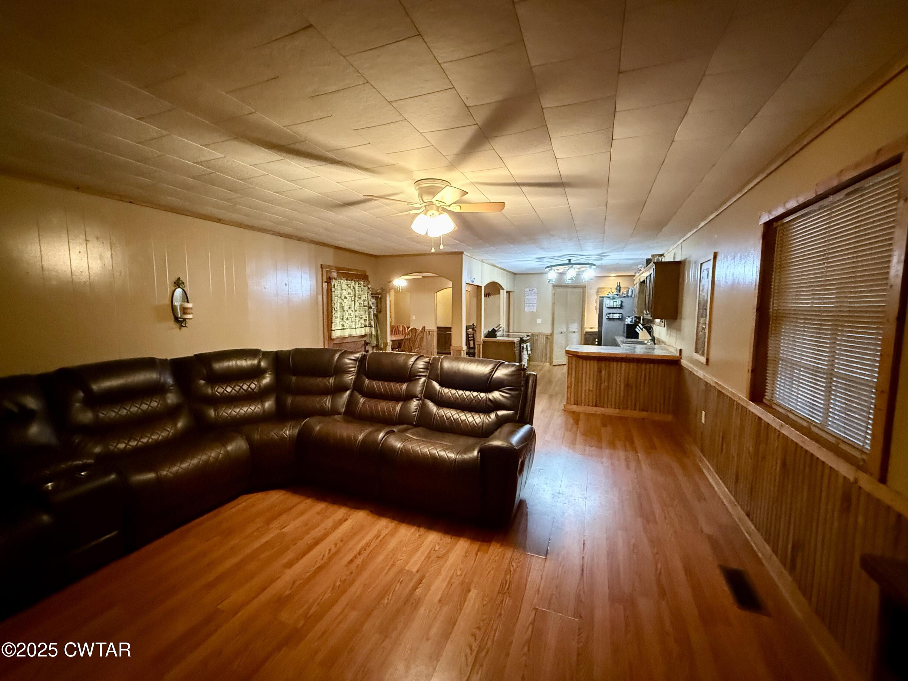 5264 Hines Gin Road Selmer, TN 38375 - Photo 4 of 19 a living room with lots of furniture and a wooden floor