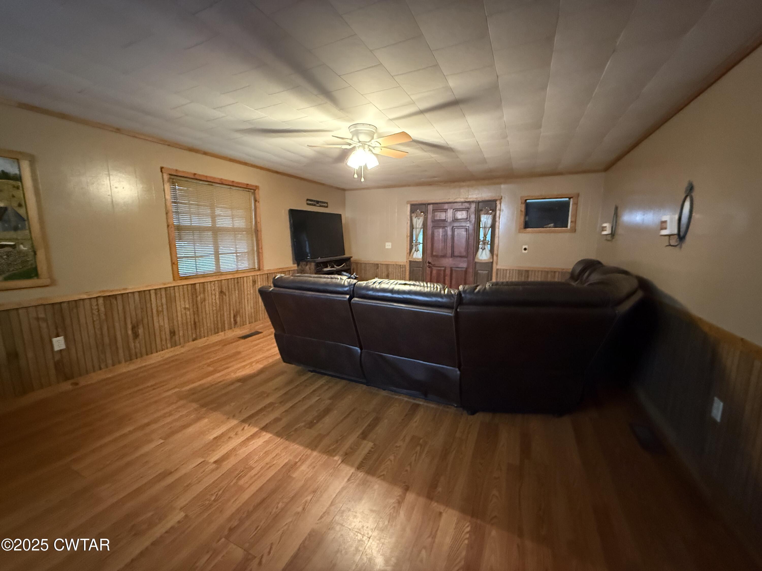 5264 Hines Gin Road Selmer, TN 38375 - Photo 5 of 19 a living room with furniture and a wooden floor