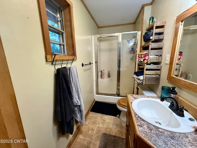 a bathroom with a tub sink and a mirror