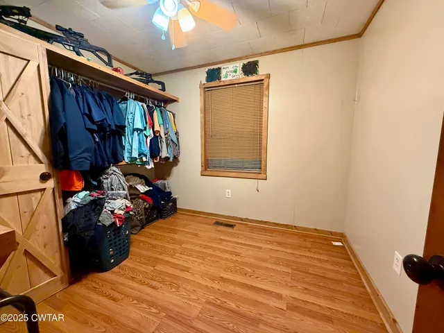 a bed room with a bed and a window