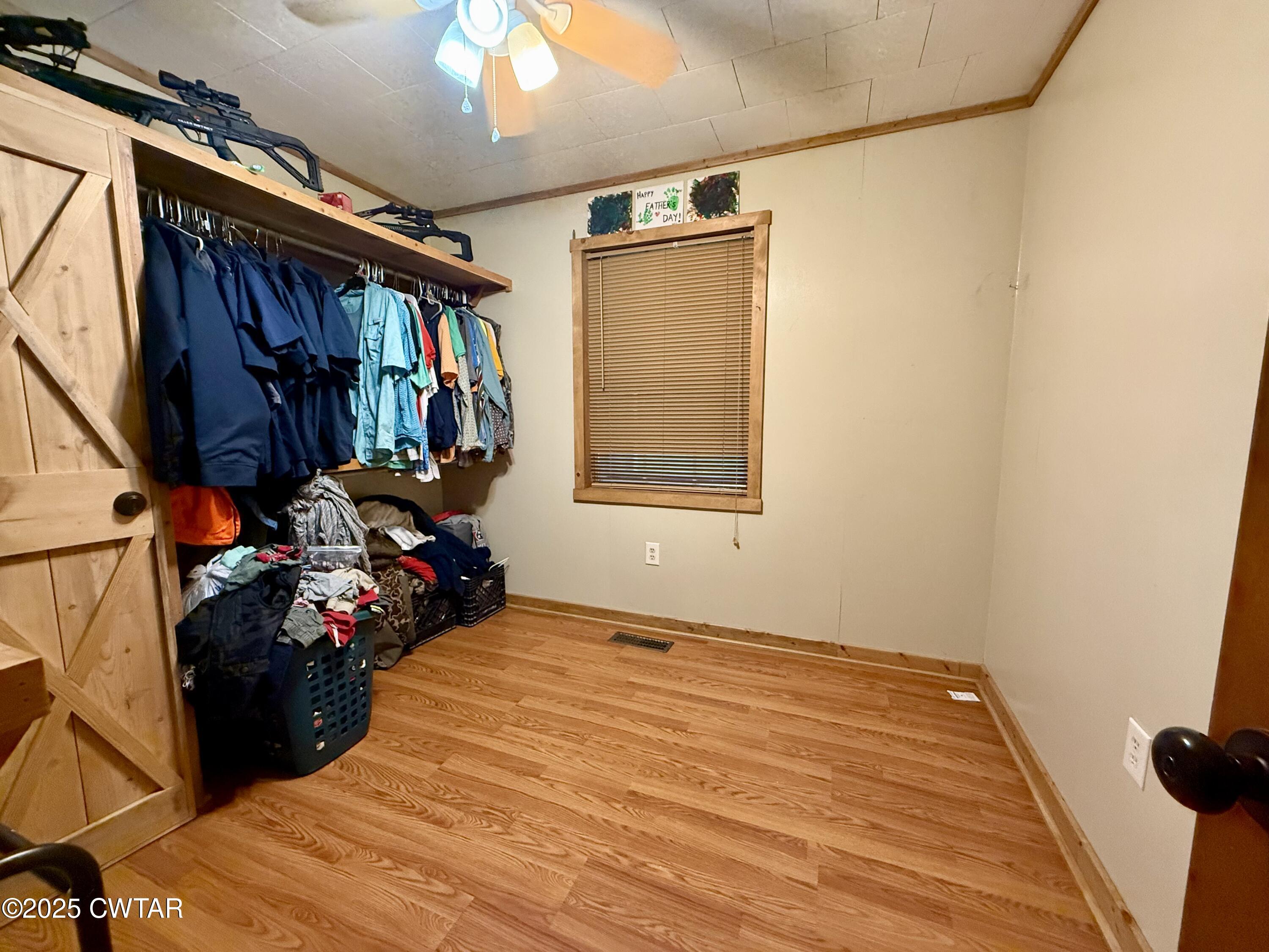 5264 Hines Gin Road Selmer, TN 38375 - Photo 10 of 19 a bed room with a bed and a window