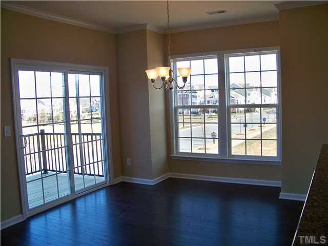 9132 Wooden Road, Unit 261 Raleigh, NC 27617 - Photo 12 of 23 The dining area is conveniently located next to the kitchen with a bar/countertop offering additional seating.