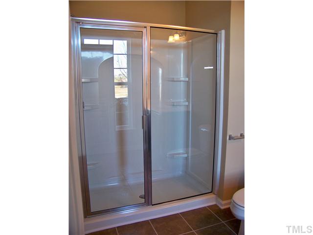 9132 Wooden Road, Unit 261 Raleigh, NC 27617 - Photo 5 of 23 The bathroom on the first floor includes a 5ft. walk-in shower.